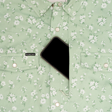 Phone in chest pocket of green floral western shirt