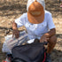 kid looking at lures wearing white short sleeve button down
