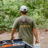 Back of bison t-shirt and man carrying turtlebox