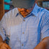 Man wearing blue plaid shirt short sleeve