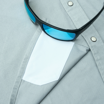 sunglasses with lens cleaner on shirt