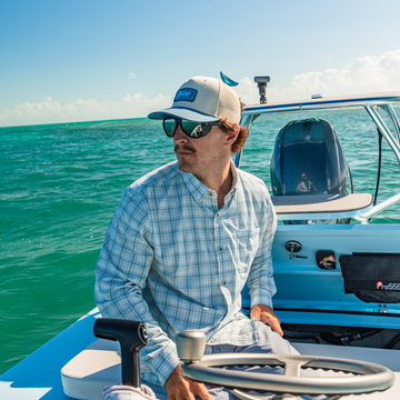 Man looking out at the water from a skiff