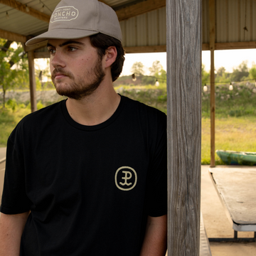 man wearing the cowboy moon tee