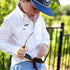 Kid cleaning sunglasses on his shirt