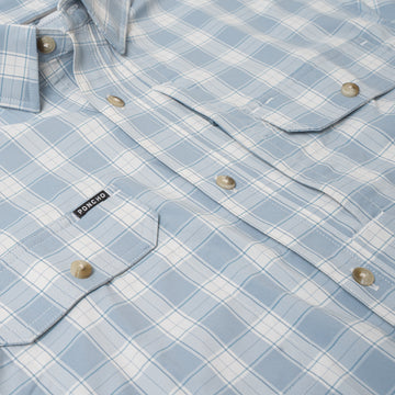 Light blue plaid button-up shirt with flap pockets featuring The Magic Ruckus label
