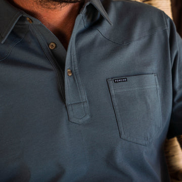 man wearing blue polo shirt