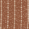Close-up of brown fabric with white star and dot pattern in vertical stripes
