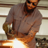 Man working in grey button down work shirts