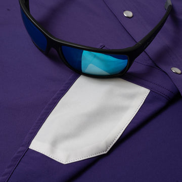 sunglasses with lens cleaner on shirt