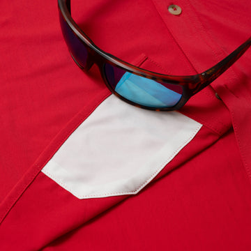 sunglasses with lens cleaner on shirt