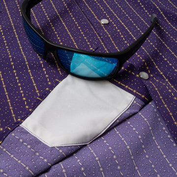 sunglasses with lens cleaner on shirt