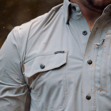 closeup of the logger shirt with sawdust on it