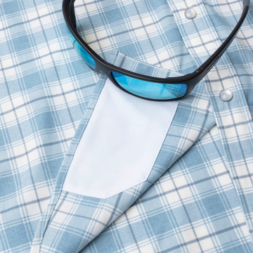 sunglasses with lens cleaner on shirt