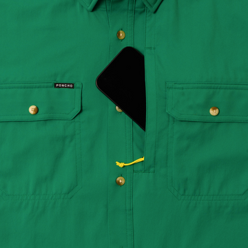 phone in chest zipper pocket of green shirt