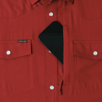 phone in chest zipper pocket of shirt