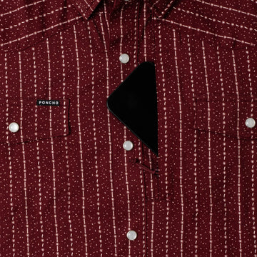 phone in chest zipper pocket of shirt
