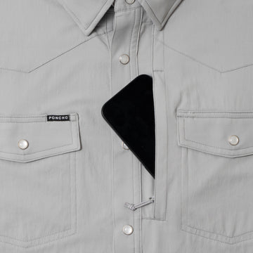 grey shirt with phone in zipper pocket
