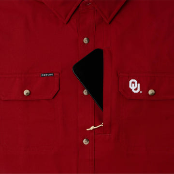 phone in chest zipper pocket of shirt