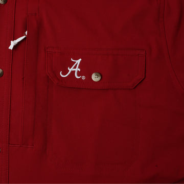 closeup of Alabama logo on pocket of shirt