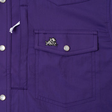 closeup of the TCU logo on pocket of shirt
