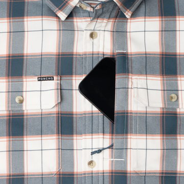 phone in chest zipper pocket of shirt