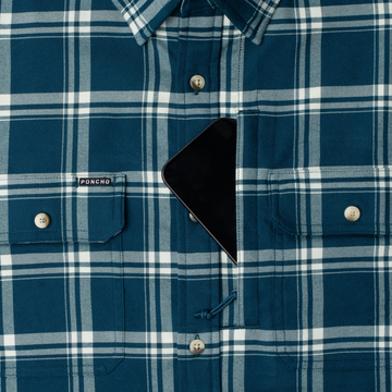 phone in chest zipper pocket of shirt