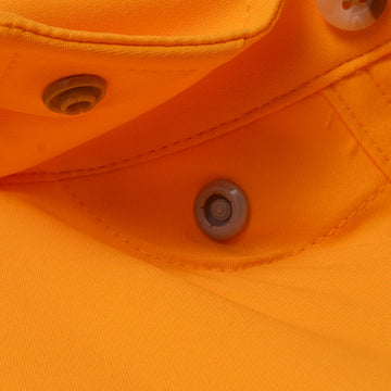 Close-up of orange fabric and button details on The First and Goal shirt