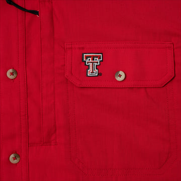 Closeup of texas tech logo on pocket of shirt