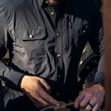 man working wearing black long sleeve shirt