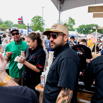 Man looking out into the crowd at a food festival