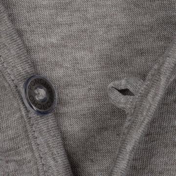 Close-up of grey breathable fabric and button detail on The Albright shirt