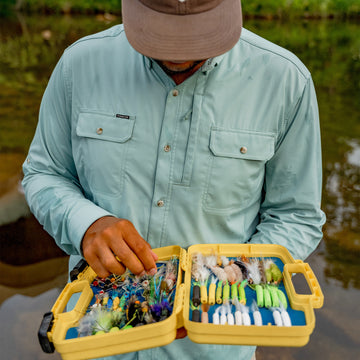 Man looking in fly box