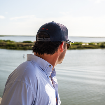 Man showing the Back of The Home Base Hat