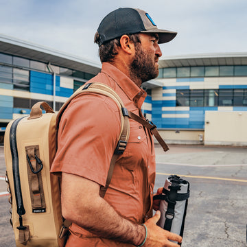 man wearing clay color short sleeve shirt