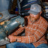 man working on boat wearing monte vista flannel