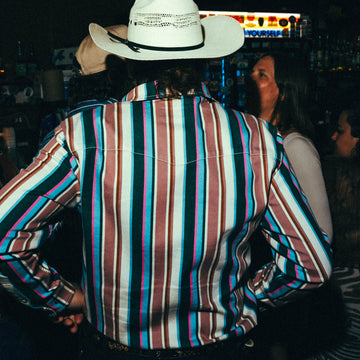 The Frontman striped outdoor shirt worn by a man with a white cowboy hat