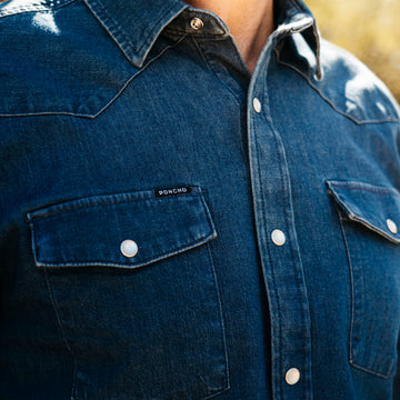 Close-up of a dark denim shirt pocket from The Sanderson outdoors collection