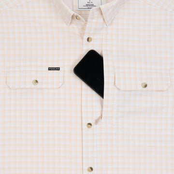 Phone in chest zipper pocket of shirt