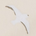 silhouette of a seagull in flight against a light background