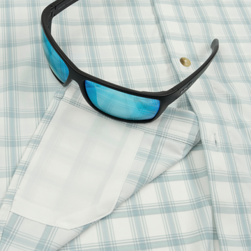 sunglasses with lens cleaner on shirt