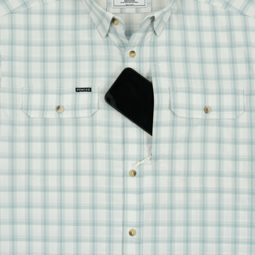 phone in chest zipper pocket of shirt