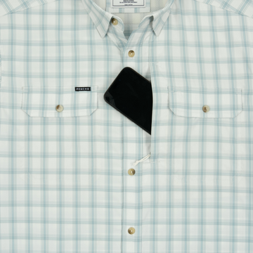 Phone in chest zipper pocket of shirt