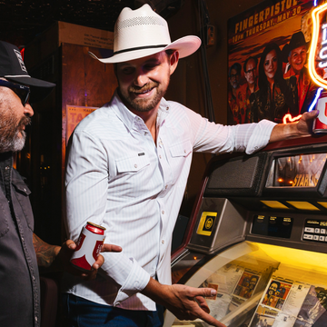 man at jukebox wearing the 2 step shirt