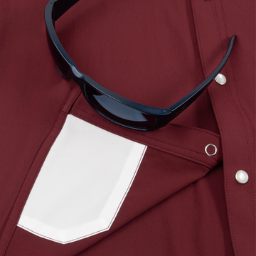 Closeup of sunglasses with lens cleaner on shirt