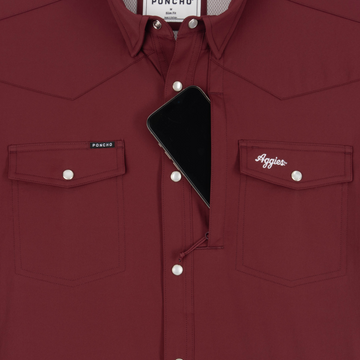 Phone in chest zipper pocket of shirt