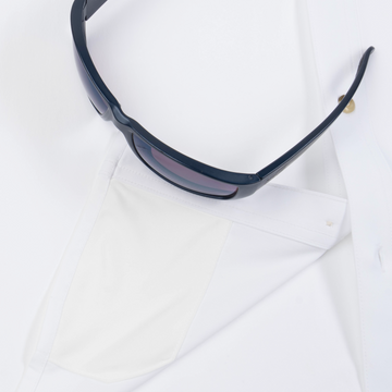 Closeup of sunglasses with lens cleaner on shirt