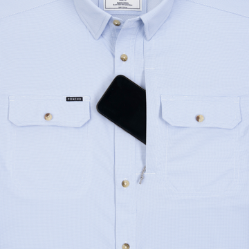 Phone in chest zipper pocket of shirt