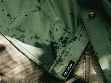 closeup of tuff thread patch with man wearing shirt