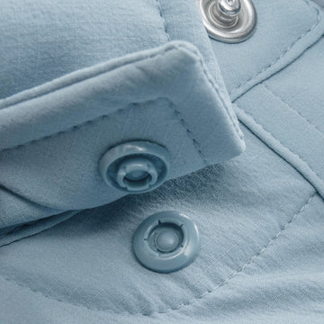 Closeup of collar snaps on collar of shirt