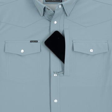 Phone in chest zipper pocket of shirt